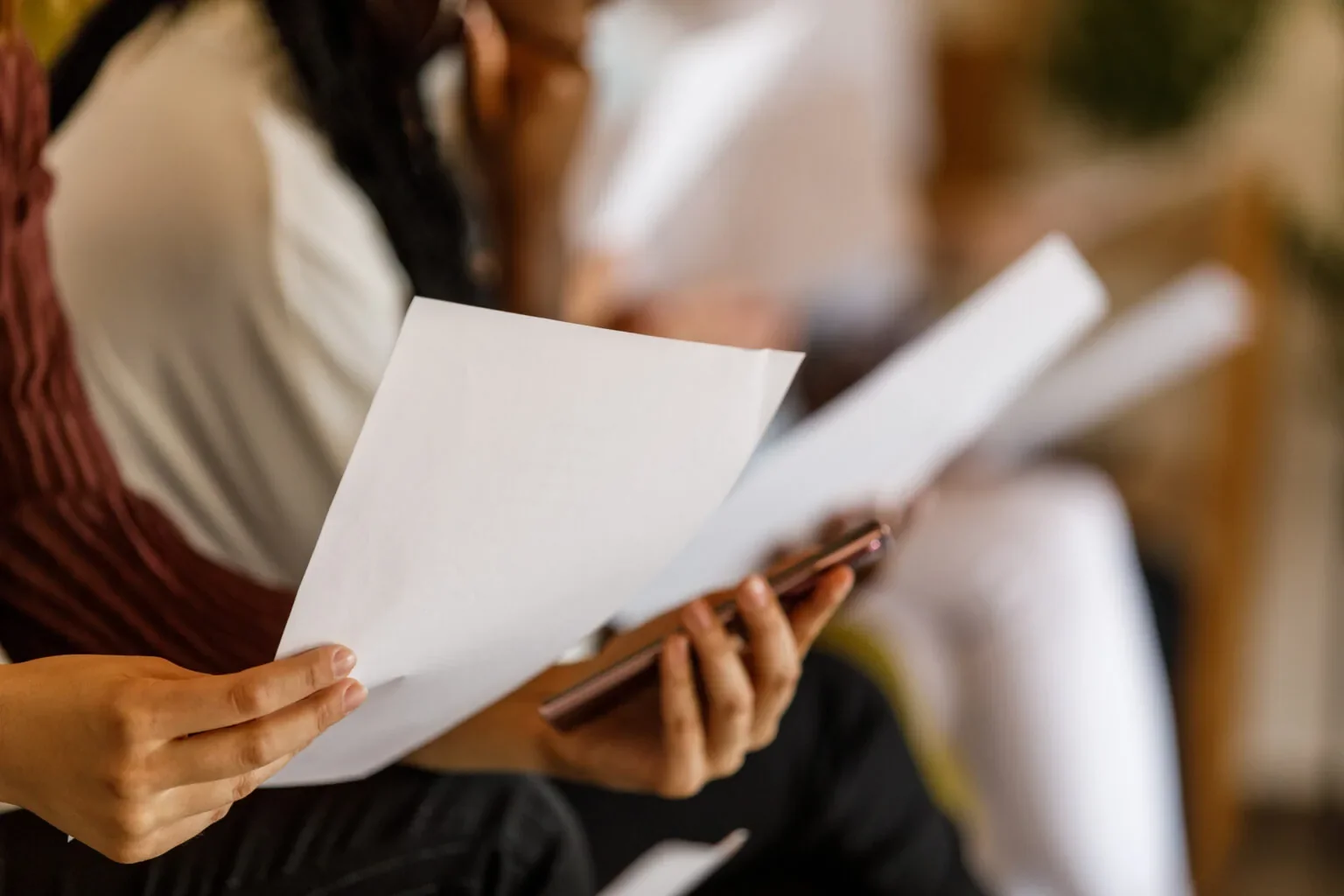 Professional reviewing AI-generated cover letter on laptop screen